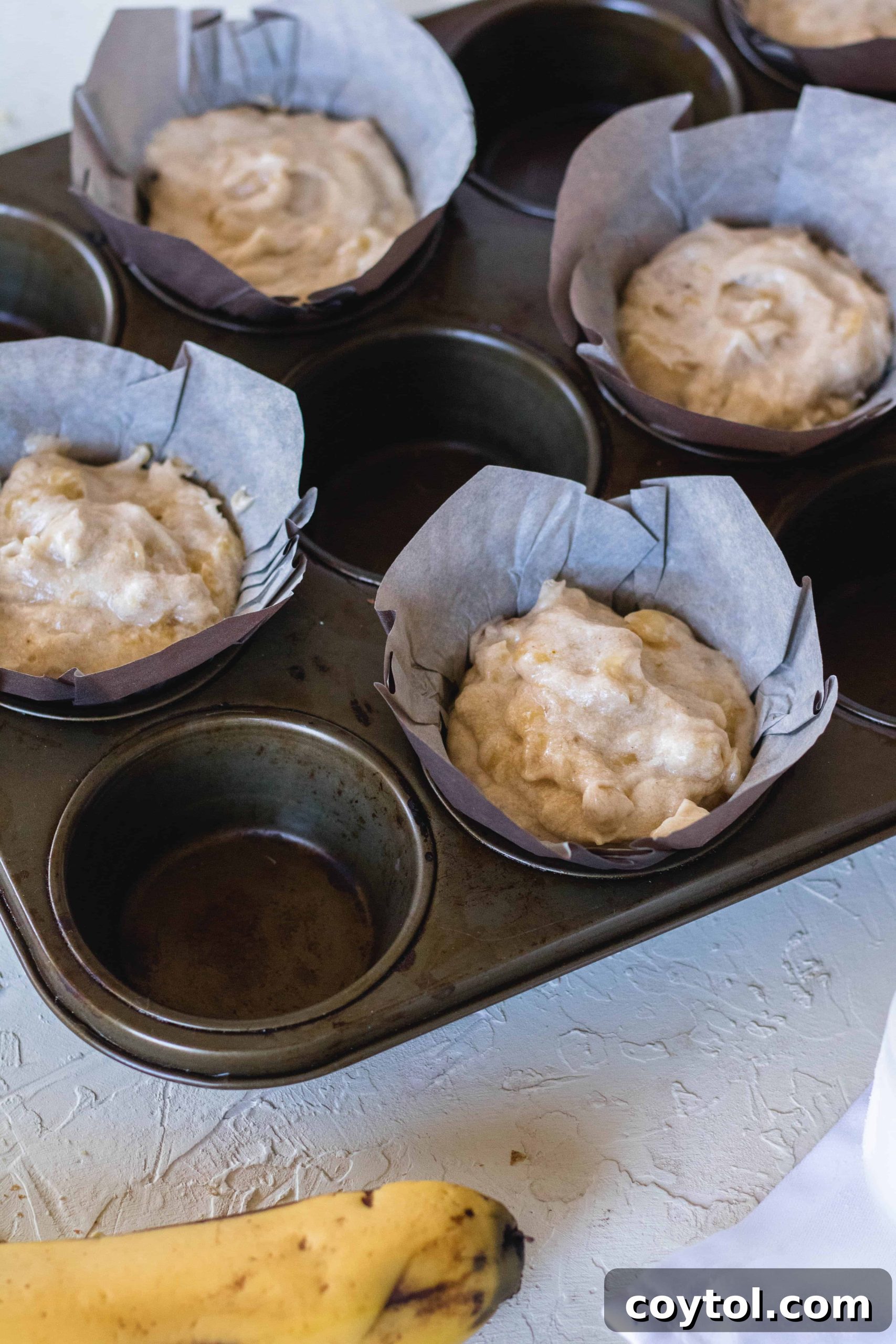 Banana nut muffins in muffin liners, ready for baking.