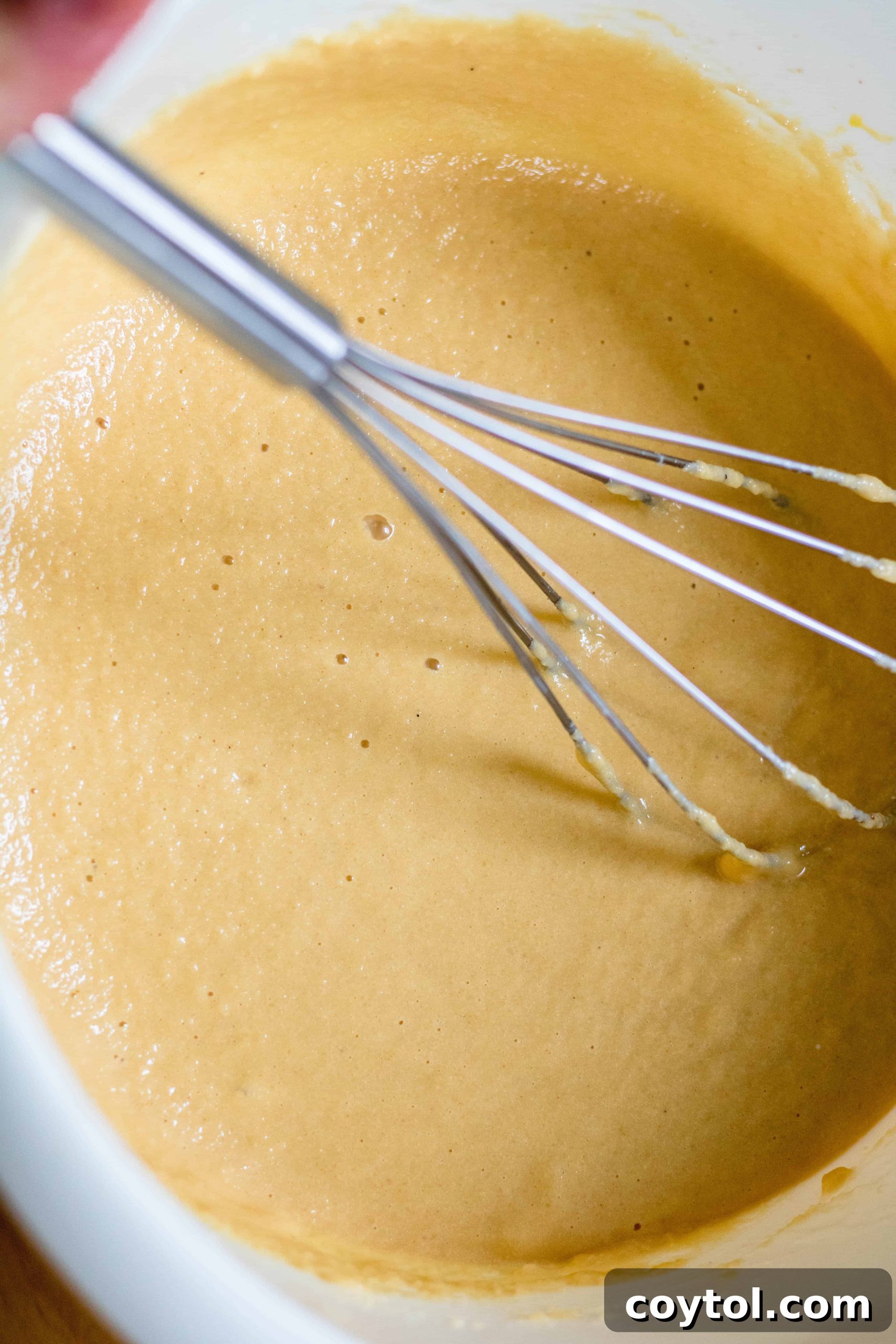 Batter of the healthy and fluffy almond flour pancakes using almond milk
