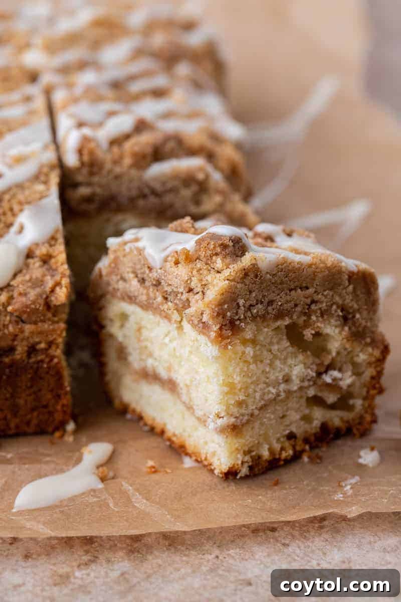 Moist slice of coffee cake with visible cinnamon streusel