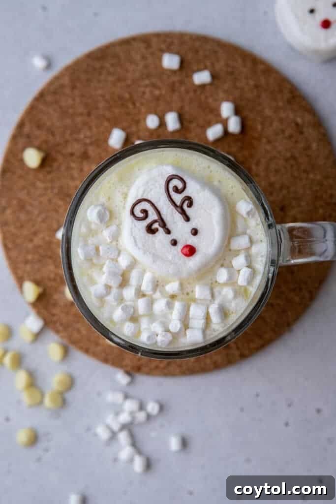 Adorable Reindeer Hot Cocoa Topper resting on a mug of hot chocolate
