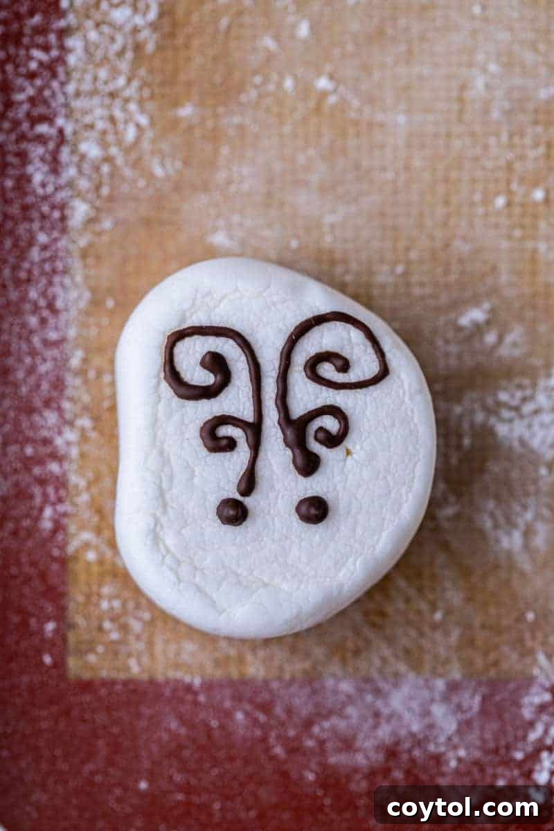 Close-up of a partially decorated reindeer marshmallow topper