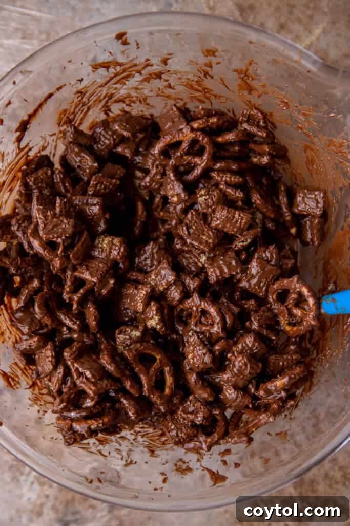 Chex cereal stirred into chocolate peanut butter mixture