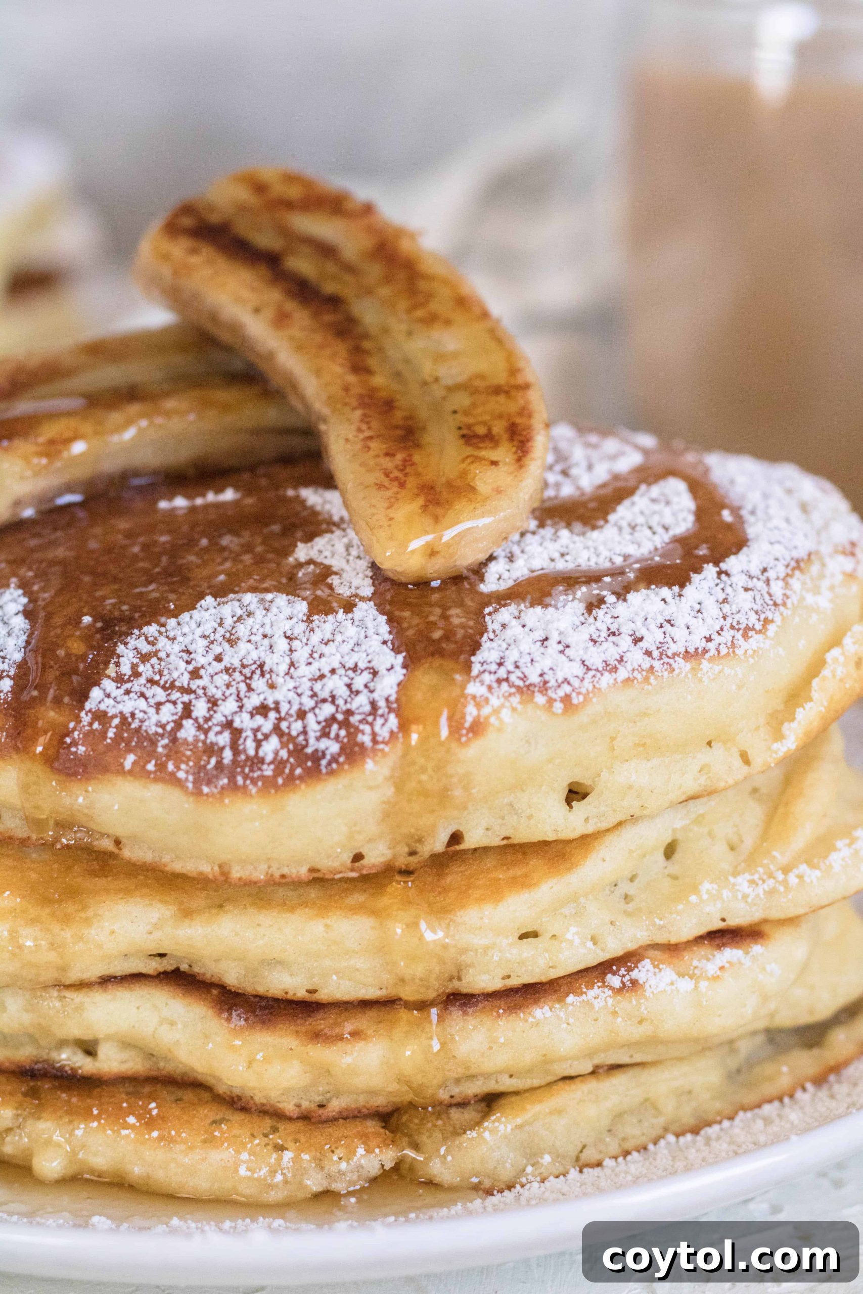 Stack of boxed pancake mix with banana on top