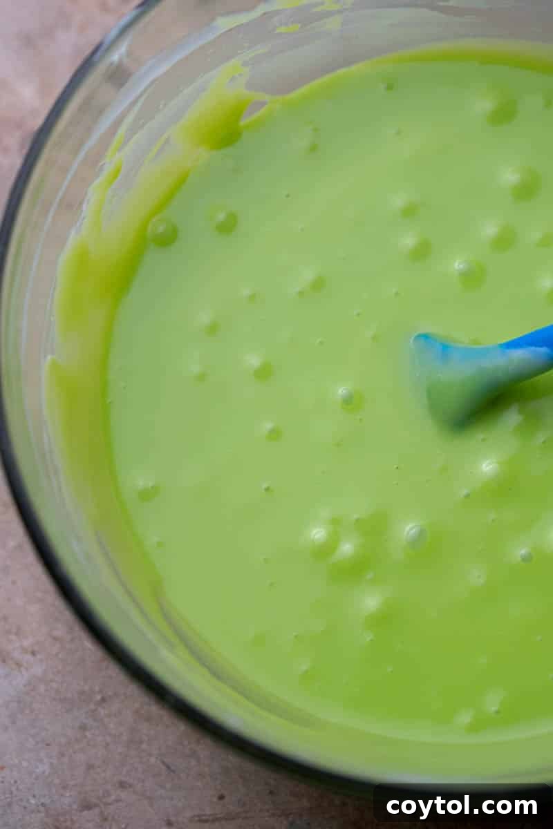 Melted white chocolate and sweetened condensed milk in a bowl
