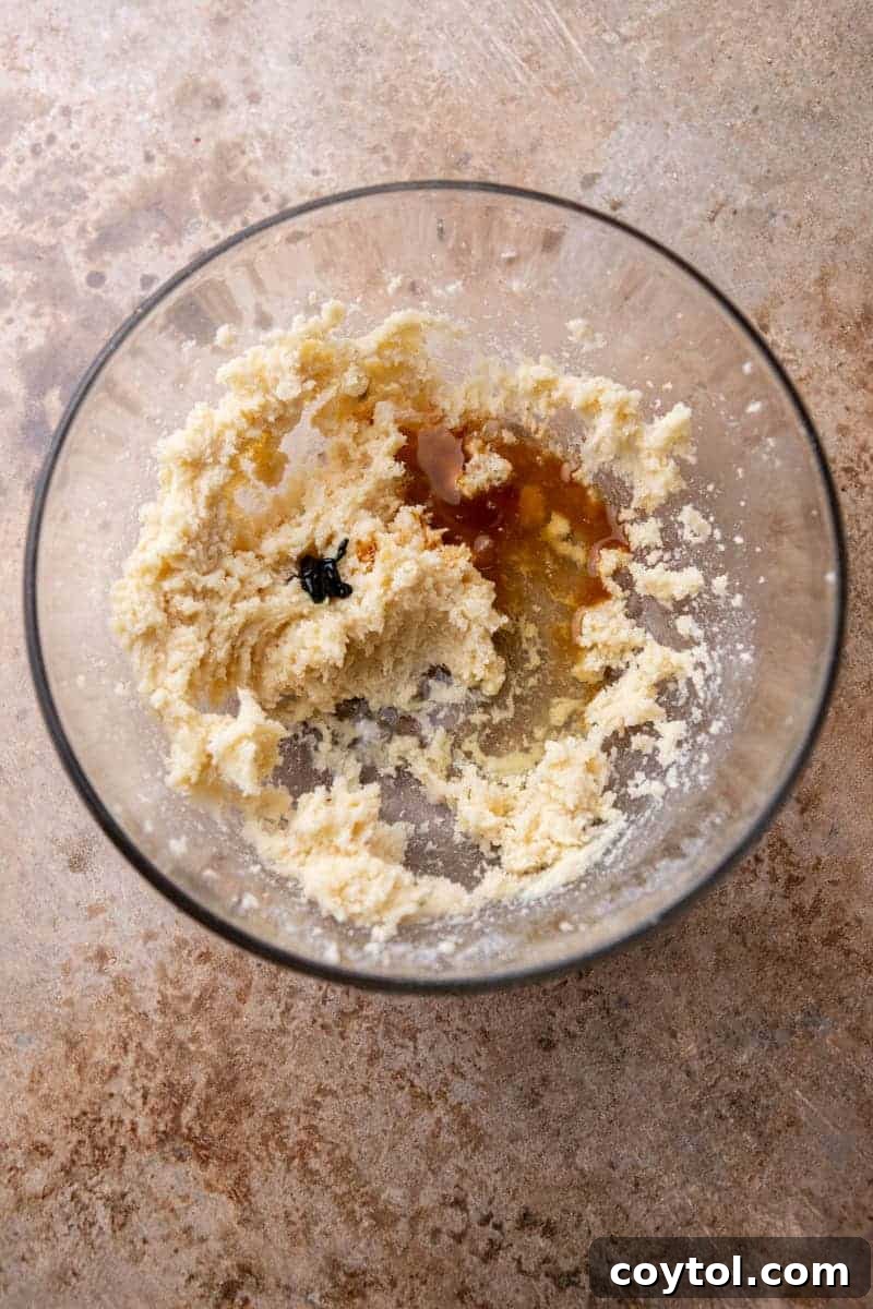 Creamed butter and sugar in a bowl, a crucial step for soft sugar cookies.