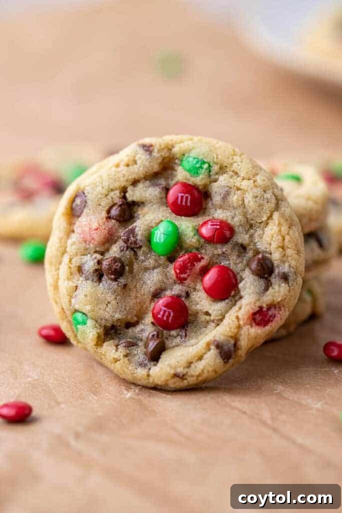 Sparkling Christmas M&Ms Chocolate Chip Cookies 2 A stack of perfectly baked Christmas M&M chocolate chip cookies with festive red and green candies