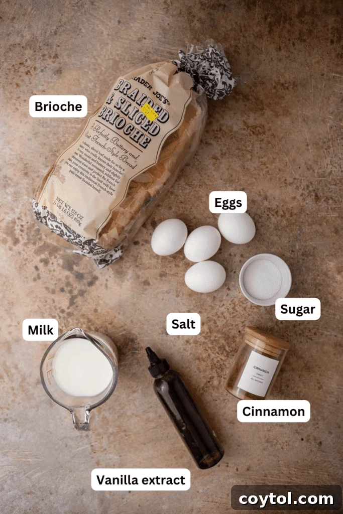 Essential ingredients for brioche french toast laid out on a kitchen counter, including eggs, milk, brioche bread, and butter.
