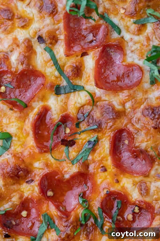 Love-Struck Pizza: Valentine's Heart Recipe 13 Close up of heart shaped pizza