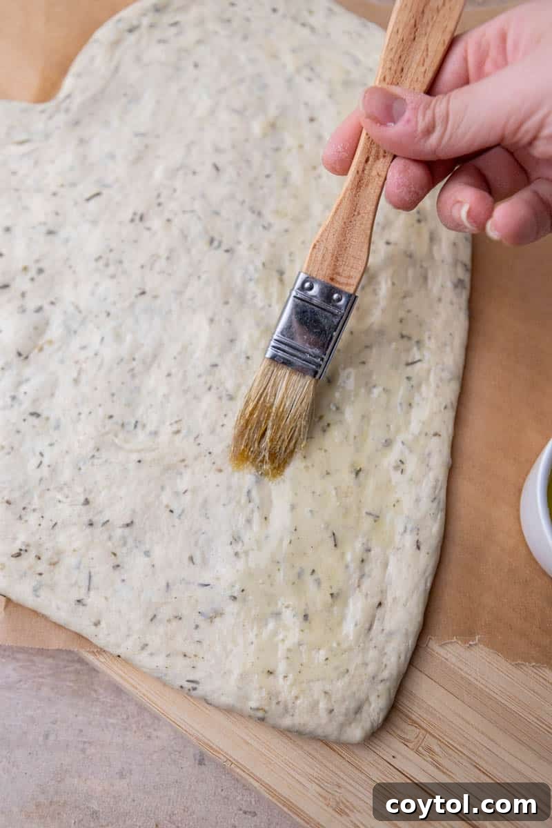 Love-Struck Pizza: Valentine's Heart Recipe 7 Brushing olive oil in pizza dough