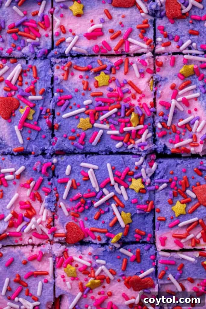 Close up of Valentine's day sugar cookie bars with frosting and sprinkles