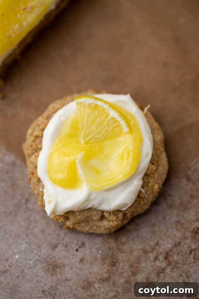 Divine Crumbl Lemon Cheesecake Cookies 11 A collection of small, catering-sized lemon cheesecake cookies elegantly arranged, perfect for parties or events.