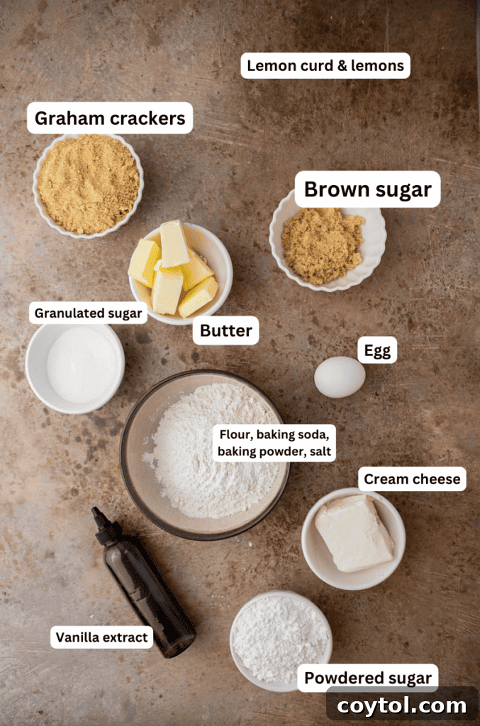 Divine Crumbl Lemon Cheesecake Cookies 3 Assorted baking ingredients for lemon cheesecake cookies, including butter, sugar, flour, graham crackers, and lemons, arranged neatly on a kitchen counter.