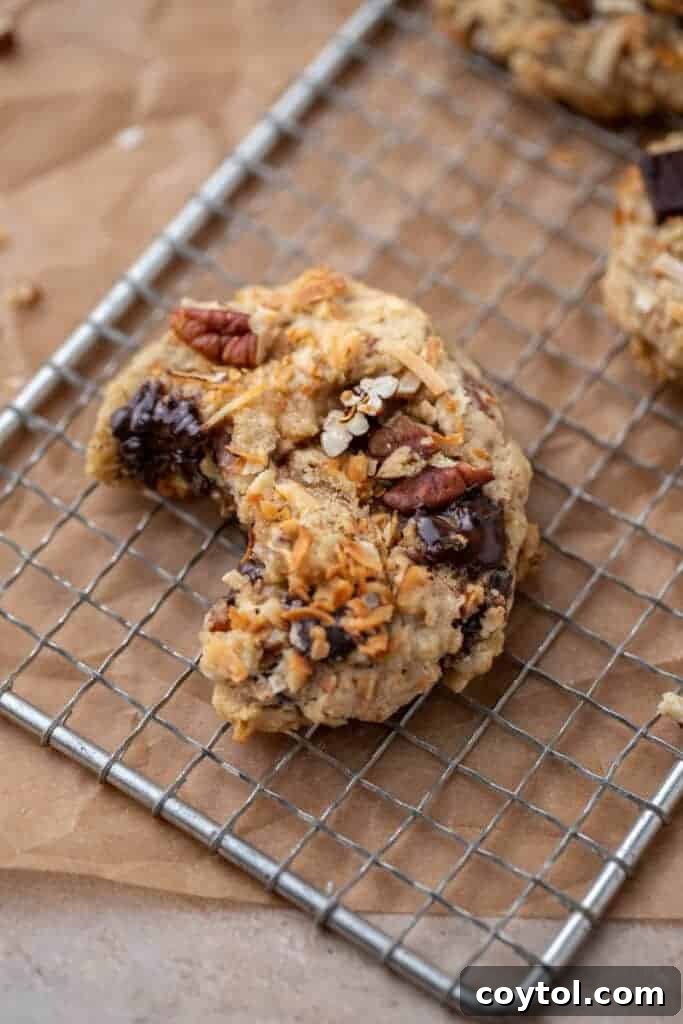 Your New Favorite Cowboy Cookie Recipe 4 Crumbl cowboy cookie with a bite taken out of it