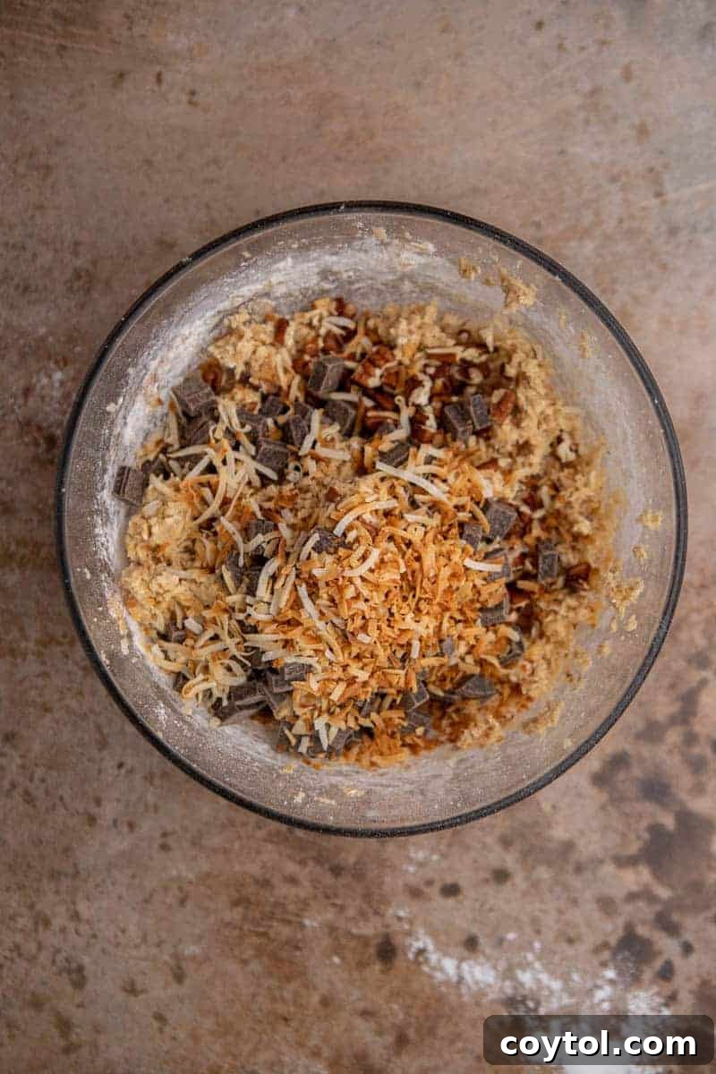 Your New Favorite Cowboy Cookie Recipe 7 Mix-ins aded to the bowl of cookie dough