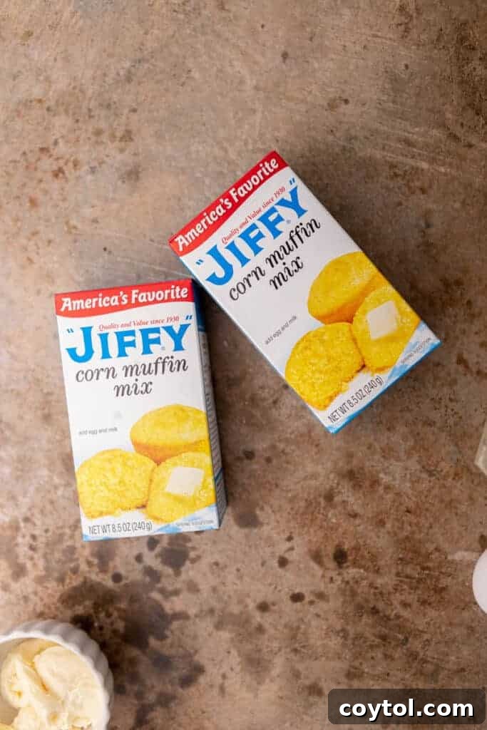 Two boxes of Jiffy corn muffin mix, essential for a thick, moist cornbread