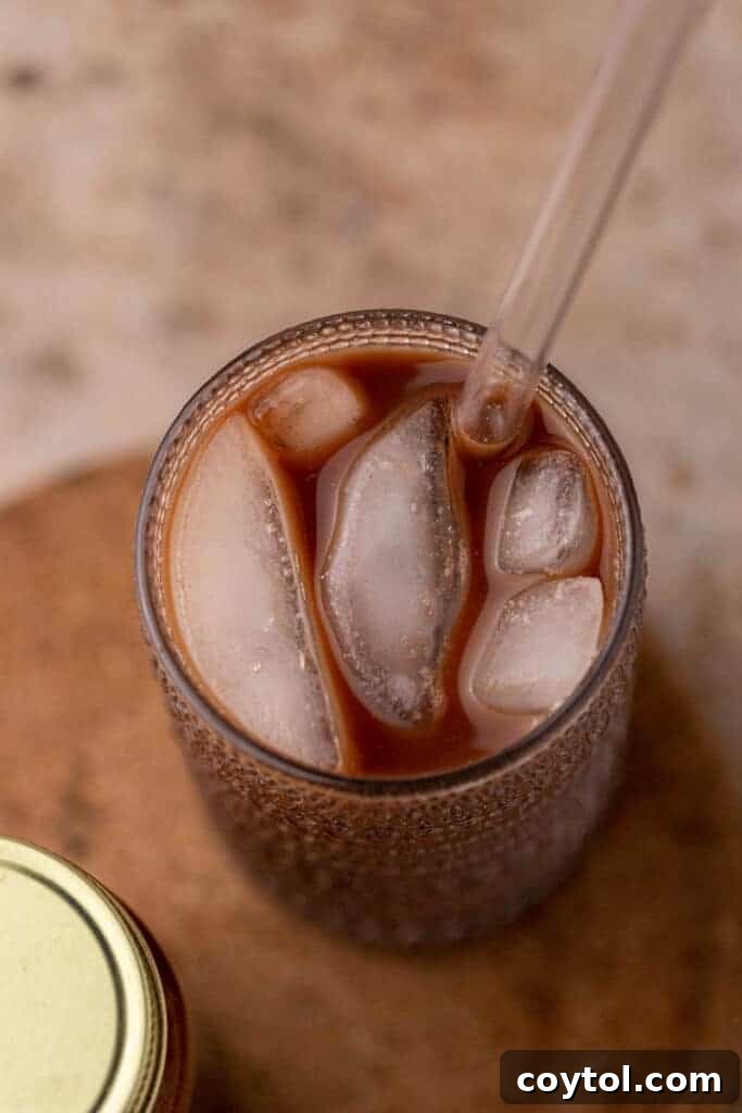 Overhead shot of an iced mocha cold brew drink with whipped cream