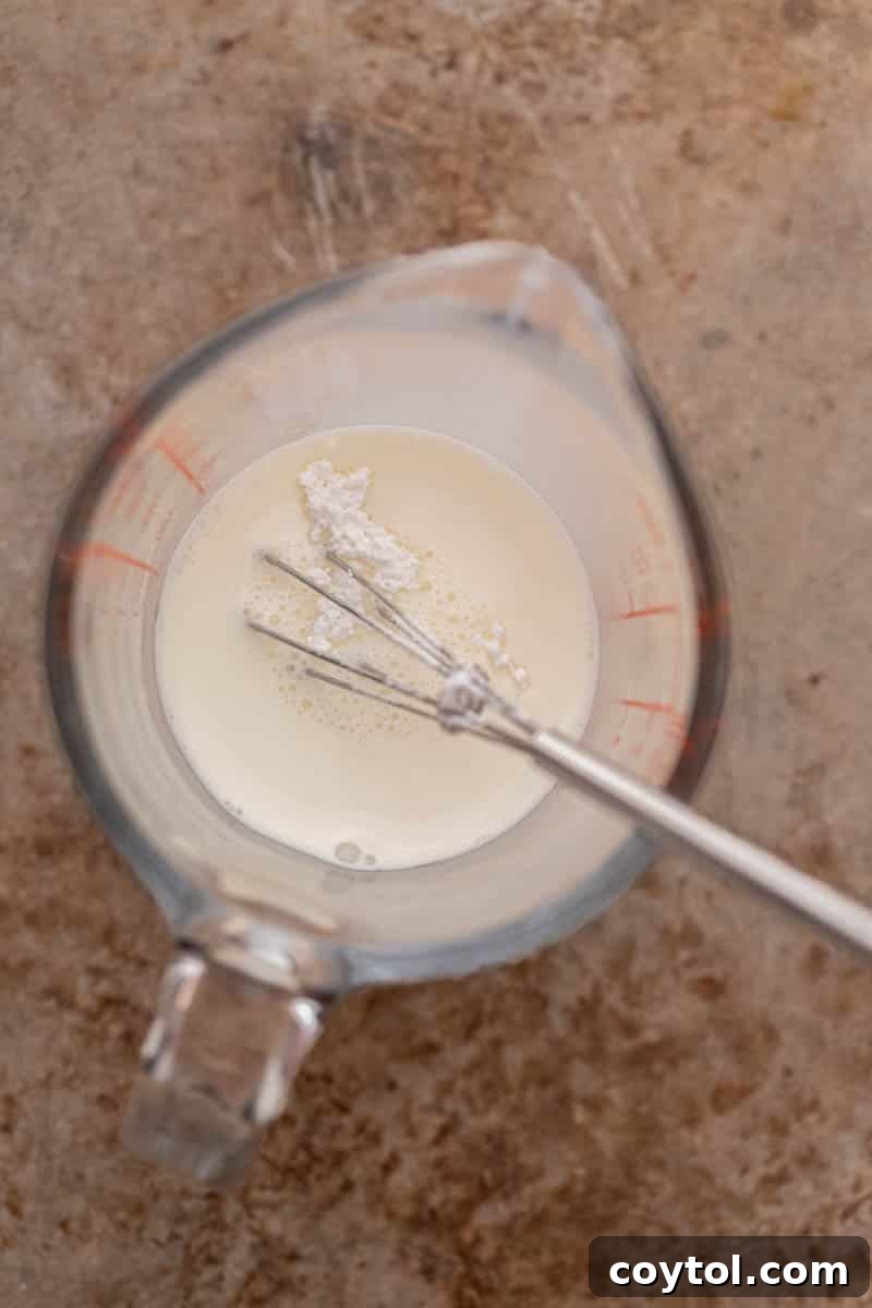 Vanilla sweet cream being poured into a cup