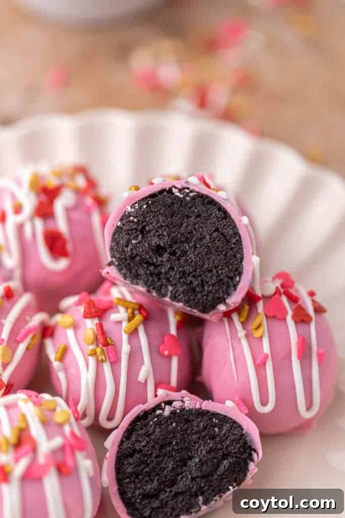 No-Fuss Valentine's Oreo Truffles 2 Valentine's Day Oreo Truffles, vibrant pink and white, adorned with festive sprinkles.