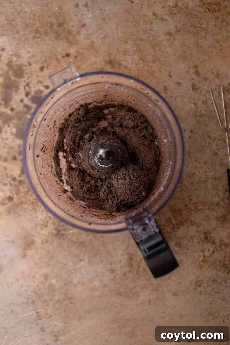 No-Fuss Valentine's Oreo Truffles 6 Truffle mixture in a food processor, showing the combined Oreo and cream cheese dough.