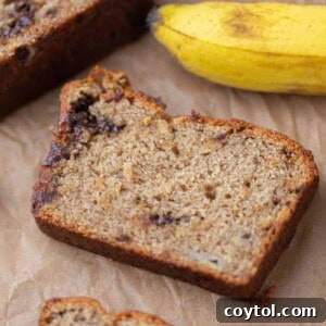 A close-up of a slice of eggless banana bread, perfect for tasting.