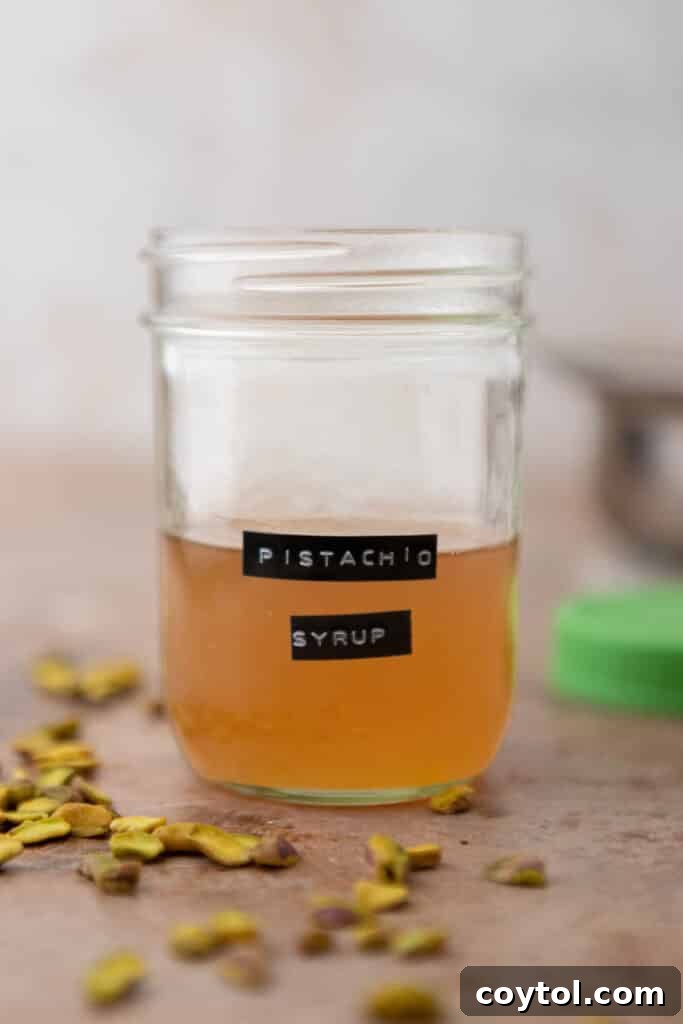Starbucks Pistachio Coffee Delight 9 Pistachio syrup in a jar with fresh pistachios