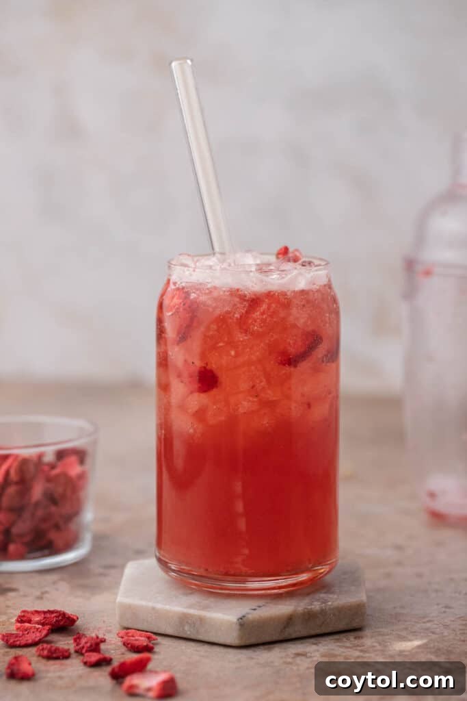 Homemade Starbucks Strawberry Acai Refresher Recipe 2 Starbucks strawberry acai refresher on a table with strawberries