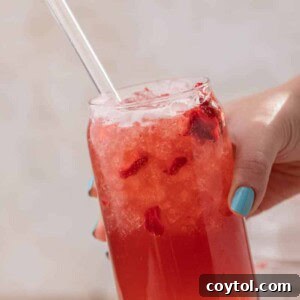 Homemade Starbucks Strawberry Acai Refresher Recipe 10 Hand holding Starbucks strawberry acai refresher