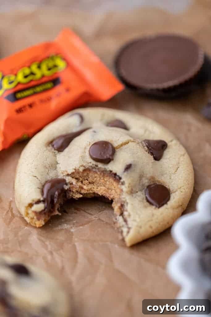 Simple Reese's Peanut Butter Explosion Chocolate Chip Cookies 11 A stack of warm Reese's stuffed chocolate chip cookies, ready to be devoured.