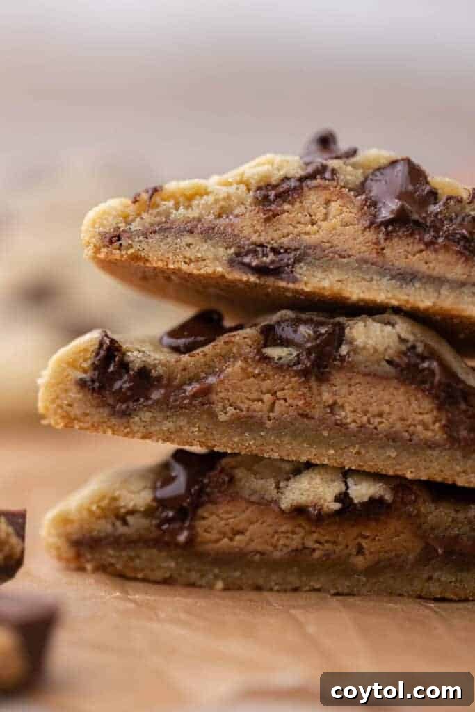 Simple Reese's Peanut Butter Explosion Chocolate Chip Cookies 4 Close up view of freshly baked Reese's peanut butter cup stuffed chocolate chip cookies, warm and ready to enjoy.