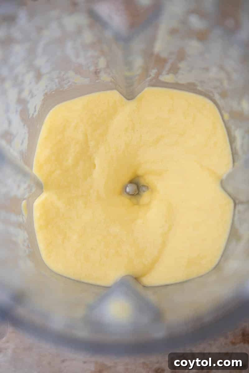 Ingredients blending smoothly in a high-speed blender.