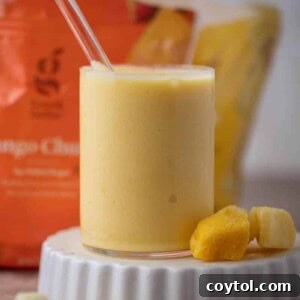 Mcdonalds pineapple mango smoothie in a glass.