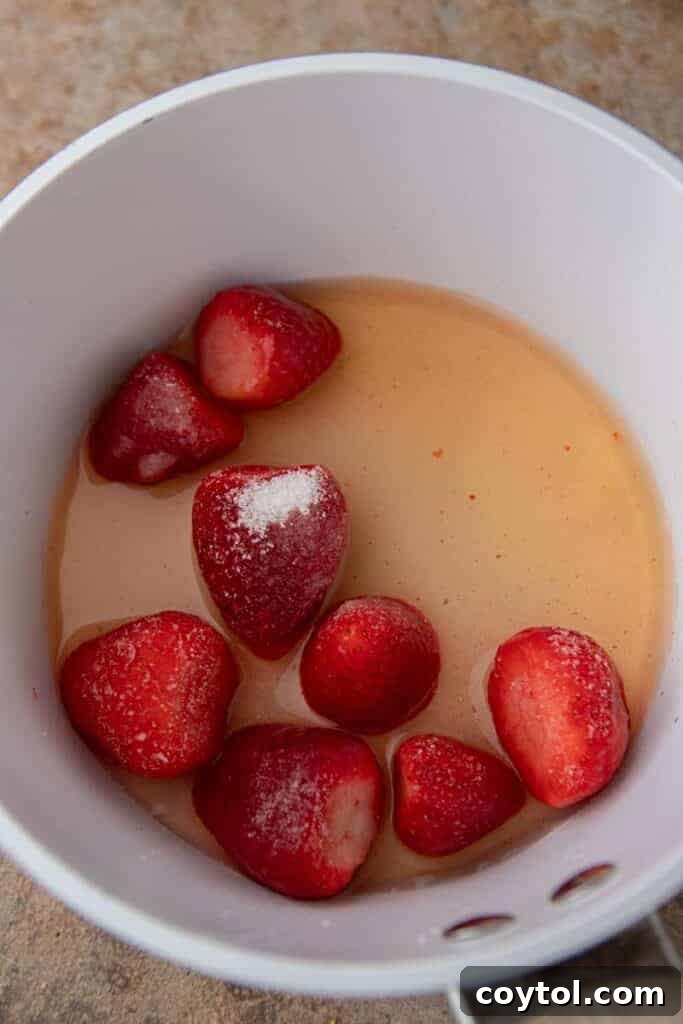 Strawberries and grape juice in a pan