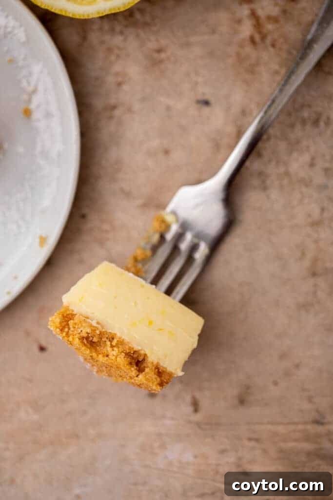Lemon bar piece on fork