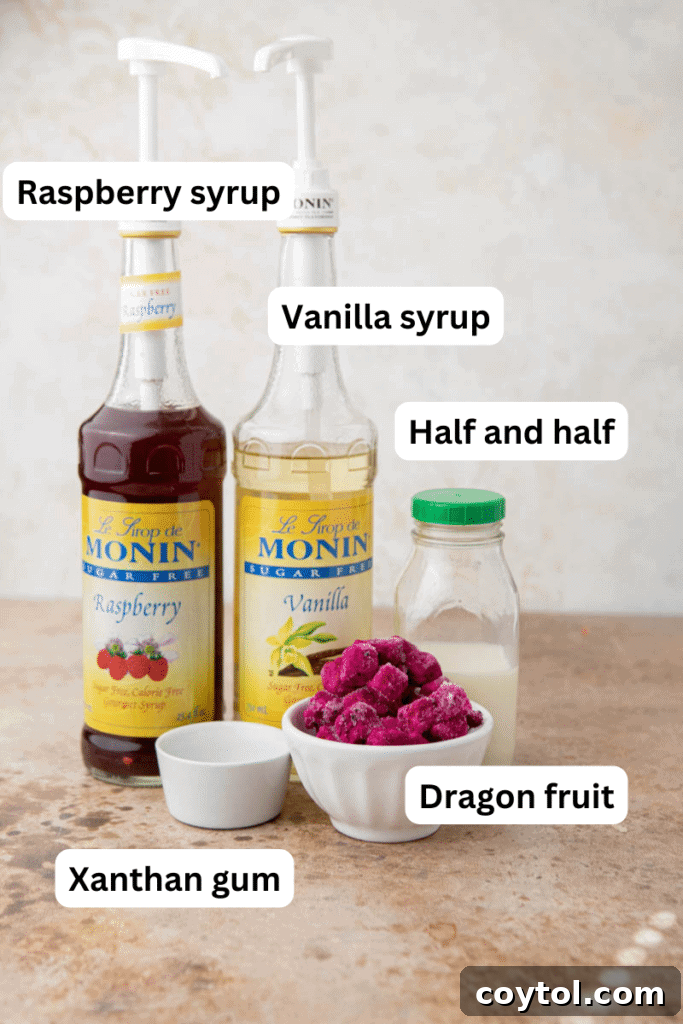 Essential ingredients for the Starbucks Barbie Frappuccino copycat recipe laid out on a kitchen counter