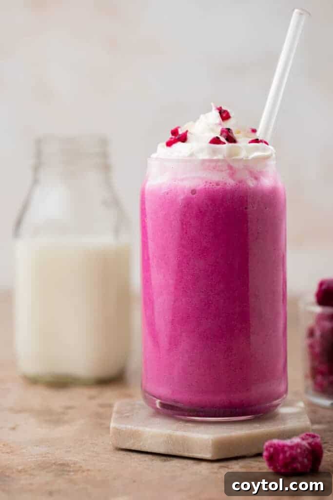 Starbucks Barbie frappuccino being poured into a glass