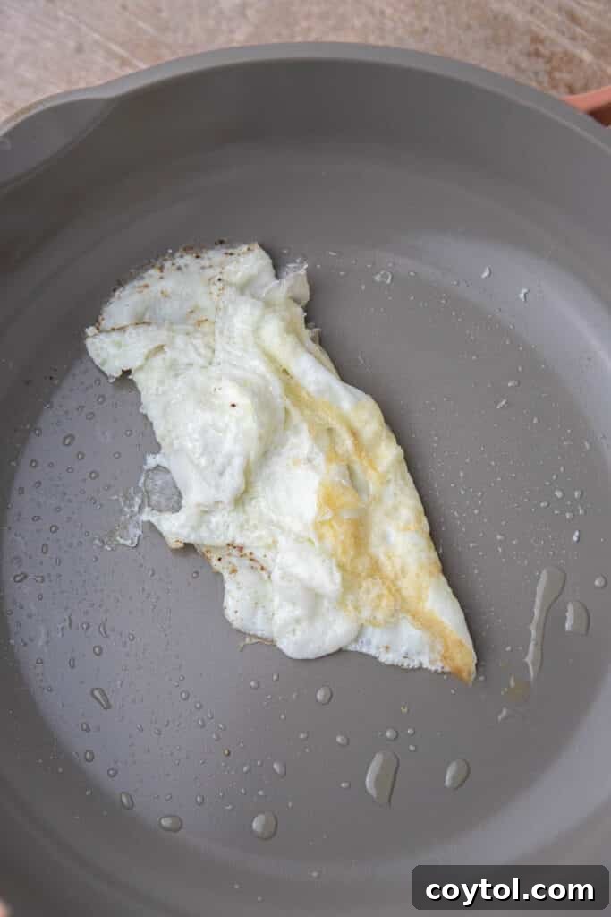 Homemade Starbucks Spinach Feta Wrap 5 Egg whites cooked in a pan for the wrap