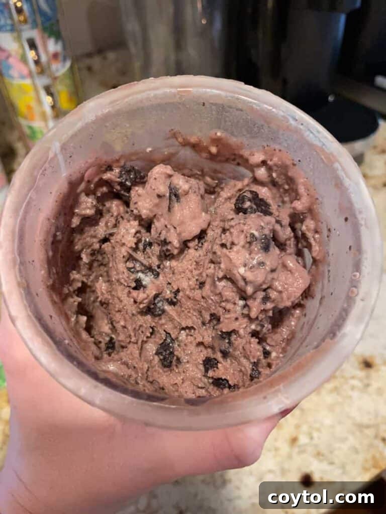 Delicious Oreo chocolate Ninja Creami ice cream, showcasing chunks of cookies mixed into the creamy base.
