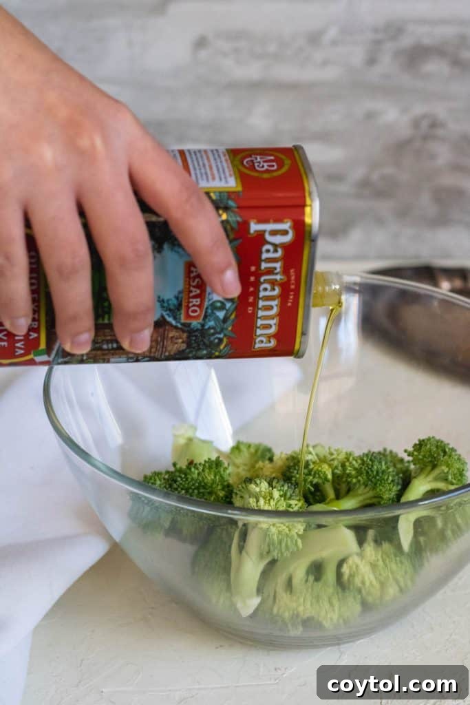 Partanna olive oil poured over broccoli florets