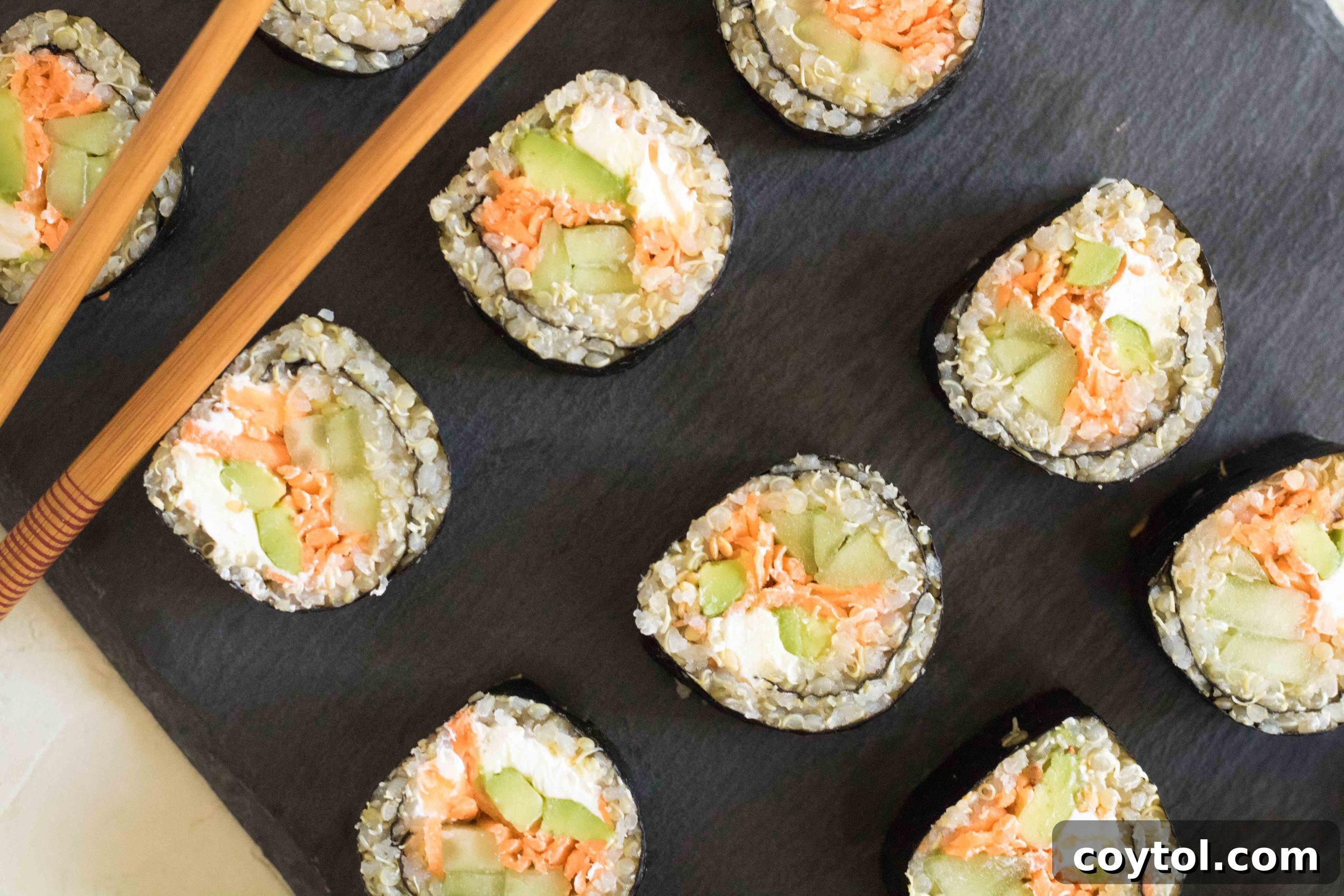 Crafting Vibrant Veggie Quinoa Sushi 14 Platter of sliced vegetable quinoa sushi rolls served with soy sauce.