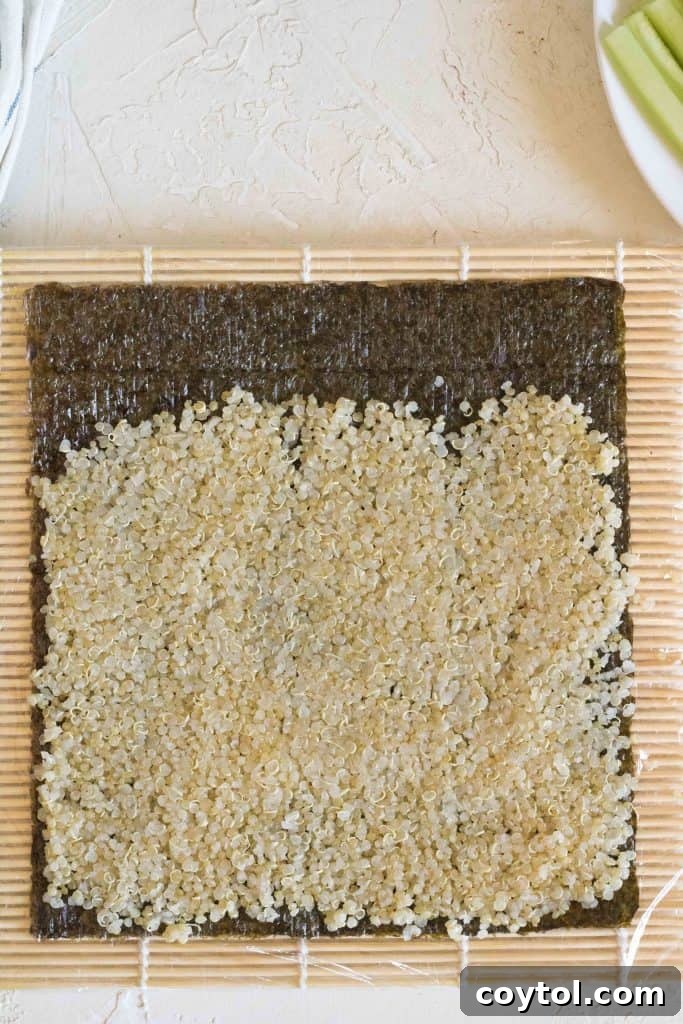 Crafting Vibrant Veggie Quinoa Sushi 9 Cucumber slices arranged on quinoa and nori for sushi.