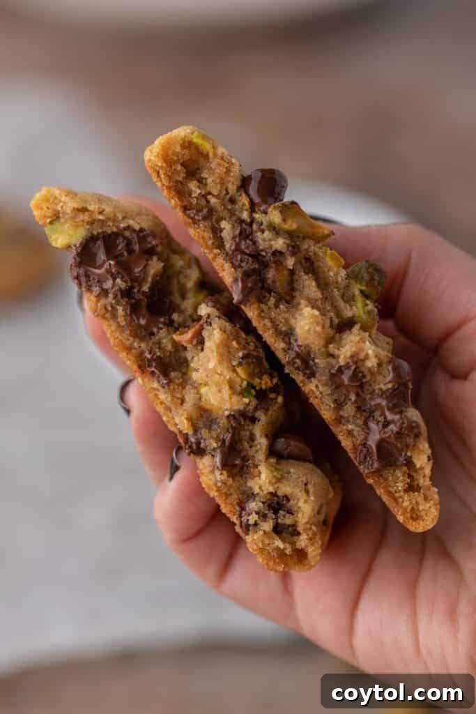 Decadent Brown Butter Pistachio Chocolate Chip Cookies 11 Freshly baked brown butter pistachio chocolate chip cookies, stacked and dusted with a hint of flaky sea salt.