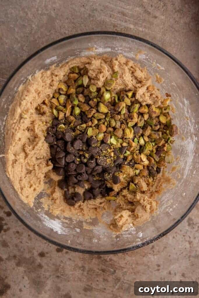 Decadent Brown Butter Pistachio Chocolate Chip Cookies 6 Cookie dough in a bowl after dry ingredients are mixed in, showcasing its consistent texture.