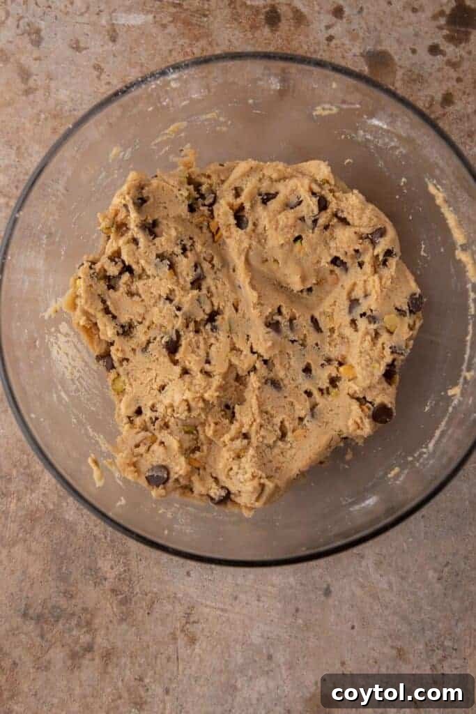 Decadent Brown Butter Pistachio Chocolate Chip Cookies 7 Chocolate chips and pistachios folded into cookie dough, ready for scooping.
