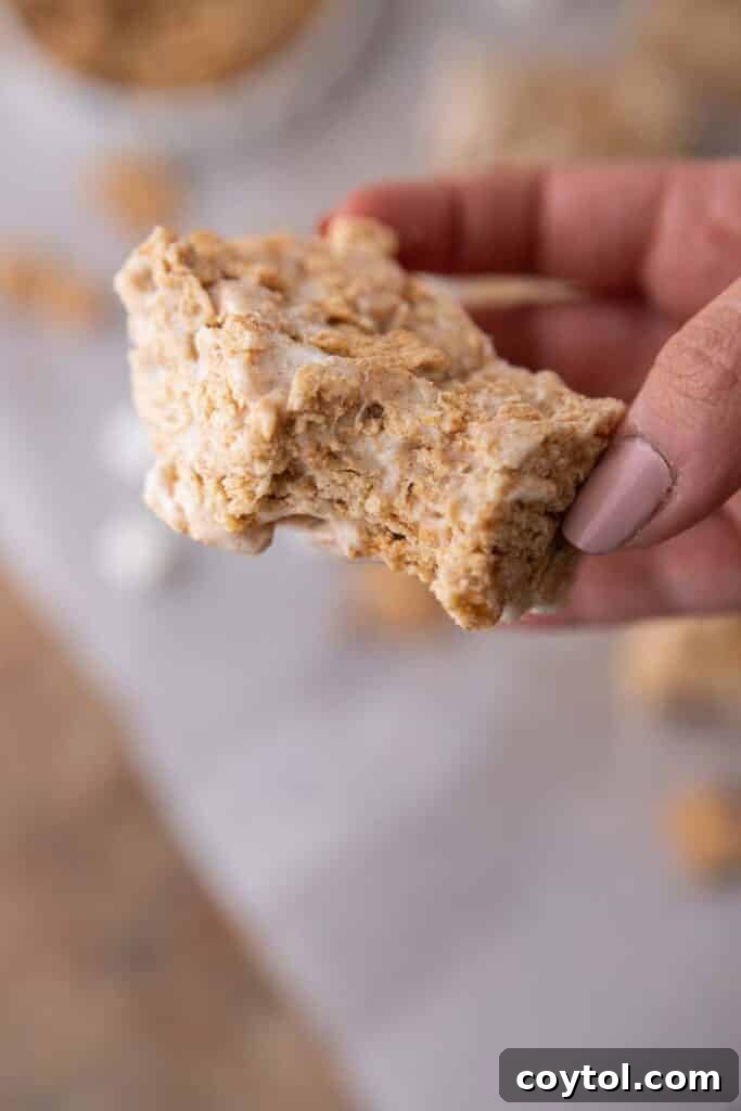 Hand holding cinnamon toast crunch bar