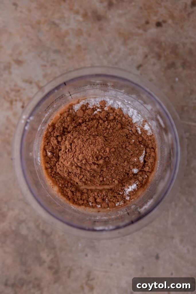 Ninja Creami: The Ultimate Chocolate Experience 4 Mixing ingredients in a Ninja Creami pint