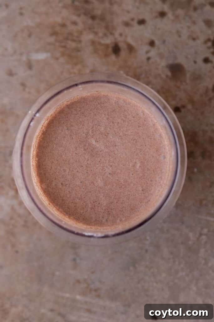 Ninja Creami: The Ultimate Chocolate Experience 5 Ninja Creami chocolate ice cream base in a pint cup