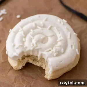 Crumbl nilla bean cupcake cookie with a bite taken out of it