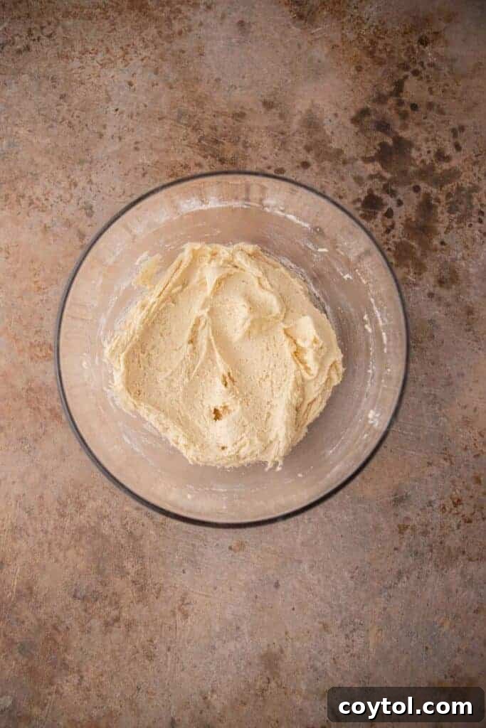 Crumbl Vanilla Bean Cupcake Dream Cookie 6 Cookie dough in a bowl