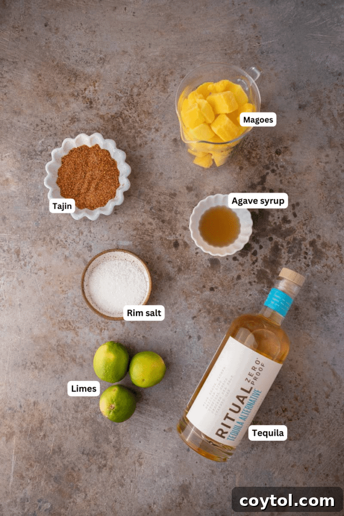 Fresh ingredients laid out on a kitchen counter, including mangoes, limes, tequila, and agave syrup.