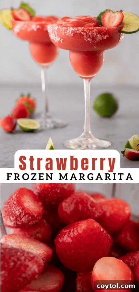 A stunning close-up of a frosty strawberry frozen margarita with a lime wedge garnish.